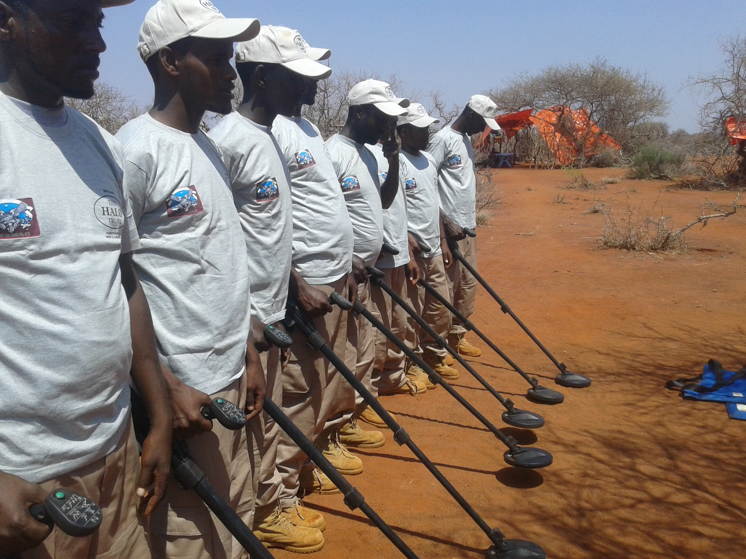 Team in Task Area  With CESMAC  T-Shirts
